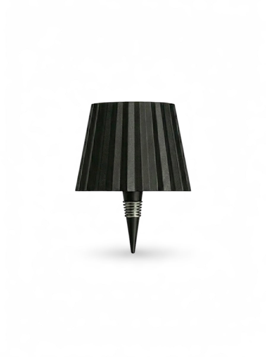 Vinlume black textured bottle lamp with pleated shade and metallic spring detail. Wireless and rechargeable.